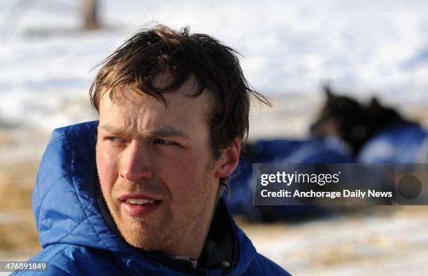 Christian Turner snacks his dogs at the Nikolai checkpoint during the 2014 Iditarod Trail Sled Dog Race on Wednesday, March 5 in Alaska.