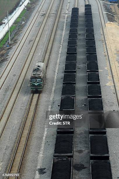 China-environment-energy-politics-Congress,FOCUS by Carol HUANG This picture taken on March 5, 2014 shows freight cars filled with coal parked inside...