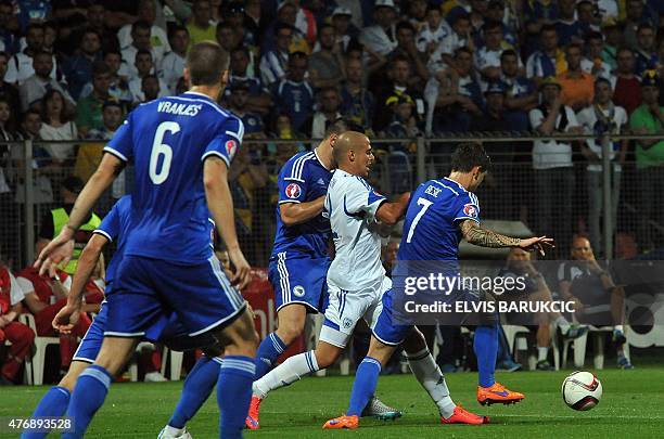 Israel's Tal Ben Haim vies with Bosnia and Herzegovina's defense during EURO 2016 qualifying match between Bosnia and Herzegovina and Israel on June...