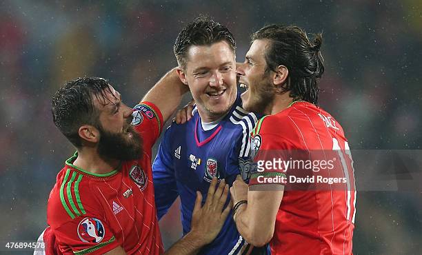 Gareth Bale, who scored the winning for Wales celebrates with team mates Wayne Hennessey and Joe Ledley after their victory during the UEFA EURO 2016...