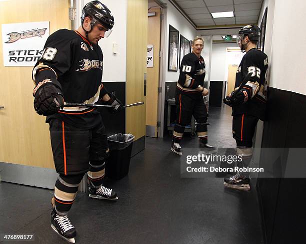 Mark Fistric, Corey Perry and Joseph Cramarossa of the Anaheim Ducks get ready for warm ups before the game against Montreal Canadiens on March 5,...