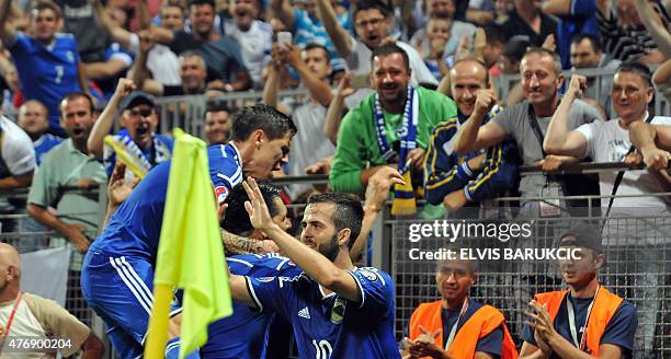 Bosnia and Herzegovina's national soccer team members celebrate after their 3rd goal during EC 2016 qualifying football match played against national...