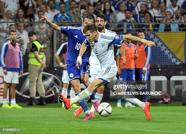 Israel's Remi Gershon vies with Bosnia's Miralem Pjanic during EURO 2016 qualifying match between Bosnia and Herzegovina and Israel on June 12, 2015...