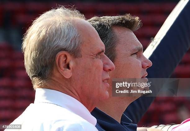 Larry Lucchino, CEO of the Boston Red Sox and Ben Cherington, general manager of the Boston Red Sox, watches batting practice before a game with the...