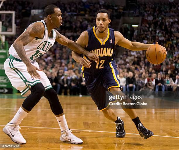 The Indiana Pacers' Evan Turner drives to the basket on the Boston Celtics' Chris Johnson during second quarter action at TD Garden on March 1, 2014.