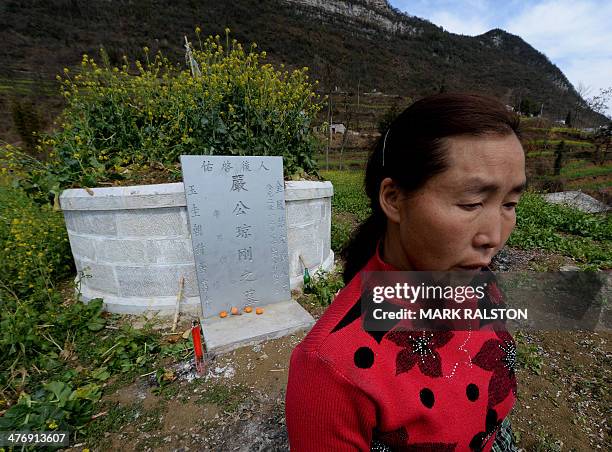 China-environment-energy-politics-Congress,FOCUS by Carol HUANG This photo taken on on February 20, 2014 shows the widow of a deceased coal miner...