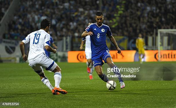 Haris Medunjanin of Bosnia in action against Orel Dgani of Israel during the UEFA EURO 2016 qualifying group B soccer match between Bosnia and Israel...