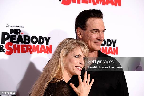 Actor Patrick Warburton and wife Cathy Jennings arrive at the Premiere of Twentieth Century Fox and DreamWorks Animation's "Mr. Peabody & Sherman" at...