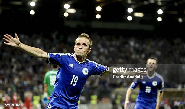 Edin Visca of Bosnia celebrates his score during the UEFA EURO 2016 qualifying group B soccer match between Bosnia and Israel in Zenica, Bosnia and...