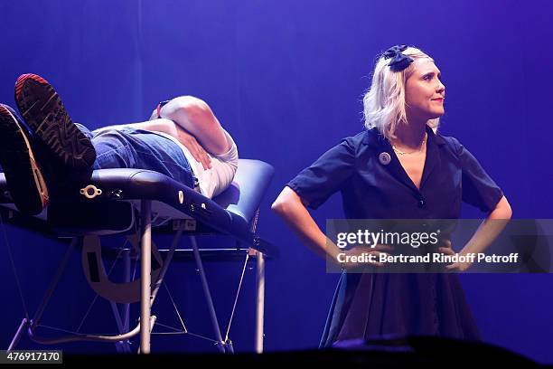 Humorist Berengere Krief Performs with a Spectator, Imitating the TV Series "Josephine, Ange gardien", at L'Olympia on June 12, 2015 in Paris, France.