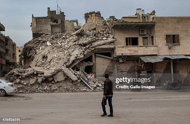 Part of a building which collapsed during a bombing on March 1, 2014 in Ma'arat al-Nu'man City, Syria. More than 20 000 people have lost their lives...