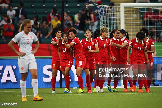 Wang Lisi of China PR celebrates with teammates after scoring the game winning goal against the Netherlands during the FIFA Women's World Cup Canada...