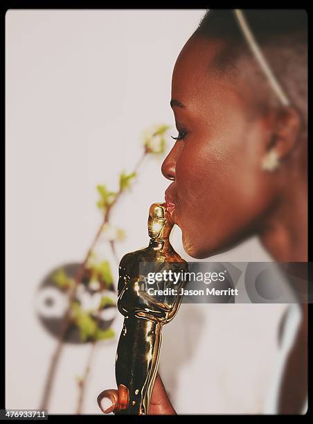 Actress Lupita Nyong'o poses in the press room during the Oscars at Loews Hollywood Hotel on March 2, 2014 in Hollywood, California.