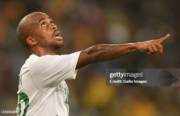 Oupa Manyisa of SA wathces the high ball during the International Friendly match between South Africa and Brazil at FNB Stadium on March 05, 2014 in...