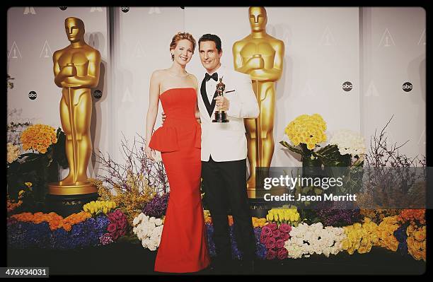 Actors Jennifer Lawrence and Matthew McConaughey, winner of Best Performance by an Actor in a Leading Role poses in the press room during the Oscars...