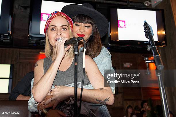 Actors Taryn Manning and Jackie Cruz perform at the "Orange is the New Black" season 3 premiere party benefiting the Women's Prison Association at...