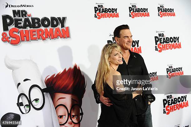 Actor Patrick Warburton R) and wife Cathy Jennings attend the premiere of "Mr. Peabody & Sherman" at Regency Village Theatre on March 5, 2014 in...