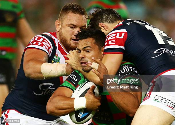 Ben Te'o of the Rabbitohs is tackled during the round one NRL match between the South Sydney Rabbitohs and the Sydney Roosters at ANZ Stadium on...