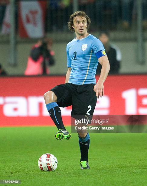 Diego Lugano of Uruguay runs with the ball during the international friendly match between Austria and Uruguay at Woerthersee stadium on March 5,...