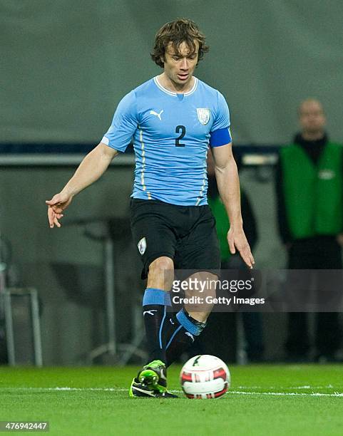 Diego Lugano of Uruguay runs with the ball during the international friendly match between Austria and Uruguay at Woerthersee stadium on March 5,...