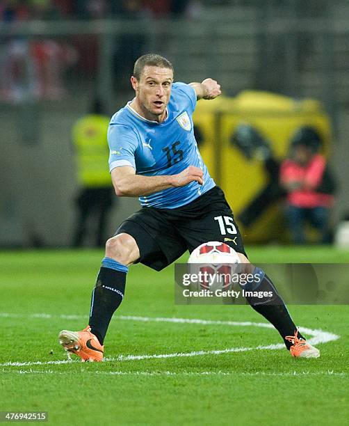 Diego Perez of Uruguay runs with the ball during the international friendly match between Austria and Uruguay at Woerthersee stadium on March 5, 2014...