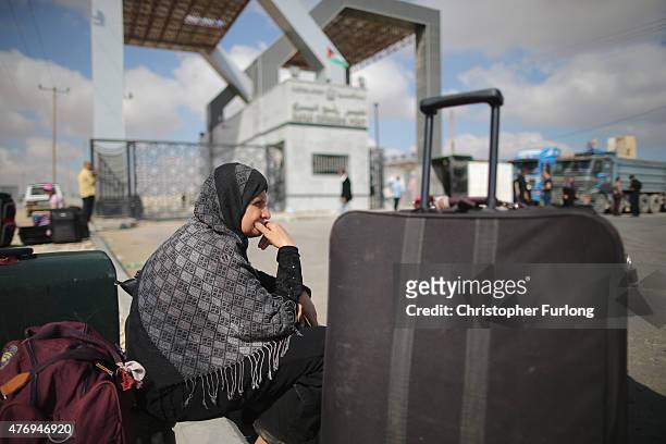 Palestinian women wait to cross the border into Egypt at the southern Gaza Rafah Crossing on June 13, 2015 in Rafah, Gaza. The Egyptian authorities...