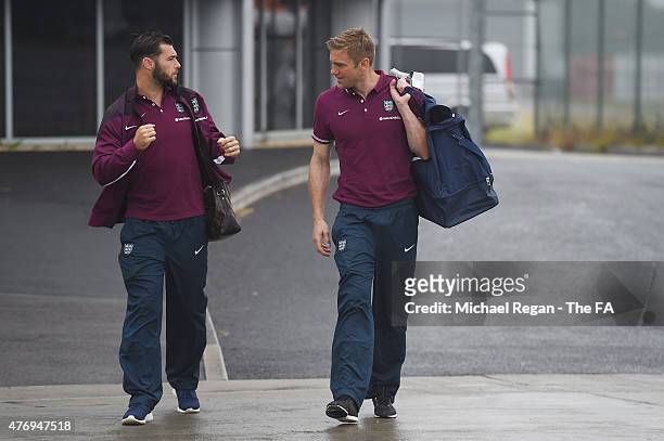 Charlie Austin and Robert Green look on as the England team fly to Slovenia on June 13, 2015 in Luton, United Kingdom.