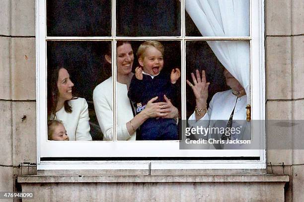 Prince George looks through a window in Buckingham Palace prior to the Trooping The Colour ceremony on June 13, 2015 in London, England. The ceremony...