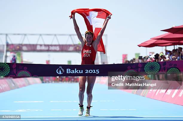 Nicola Spirig of Switzerland celebrates as she crosses the finish line to win the gold medal in the Women's Triathlon Final during day one of the...