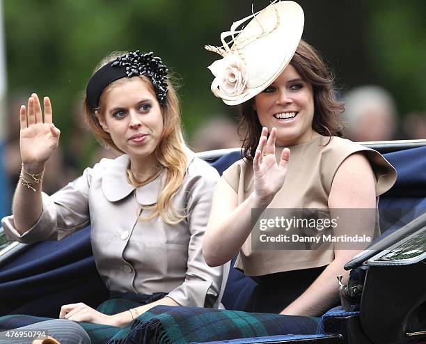 Princess Beatrice of York and Princess Eugenie of York wave at the crowd during the annual Trooping The Colour ceremony at Horse Guards Parade on...