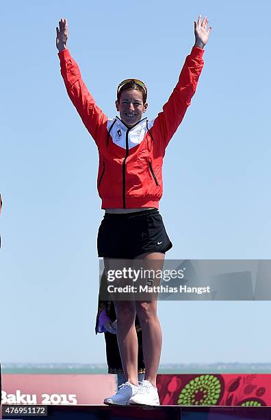 Gold medalist Nicola Spirig of Switzerland steps onto the podium prior to receiving her medal following the Women's Triathlon Final during day one of...