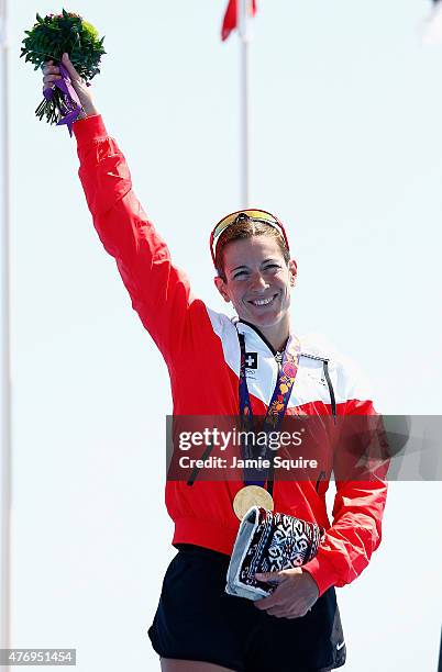 Gold medalist Nicola Spirig of Switzerland celebrates with her medal following the Women's Triathlon Final during day one of the Baku 2015 European...