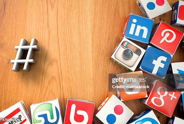 social media cubes on a wooden background - google social networking service stock pictures, royalty-free photos & images