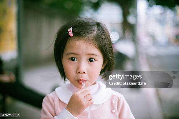 lollipop - chinese girl stock pictures, royalty-free photos & images