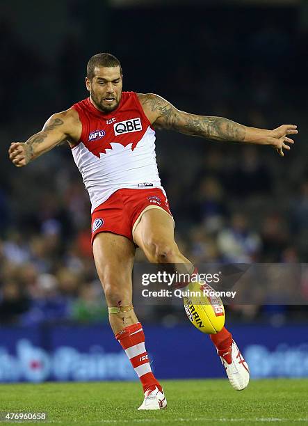 Lance Franklin of the Swans kicks during the round 11 AFL match between the North Melbourne Kangaroos and the Sydney Swans at Etihad Stadium on June...