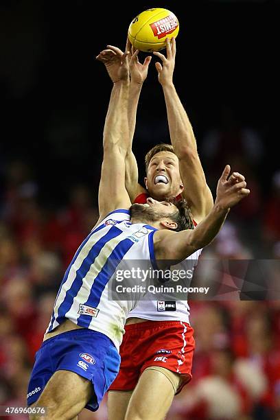 Jeremy Laidler of the Swans marks over the top of Jarrad Waite of the Kangaroos during the round 11 AFL match between the North Melbourne Kangaroos...