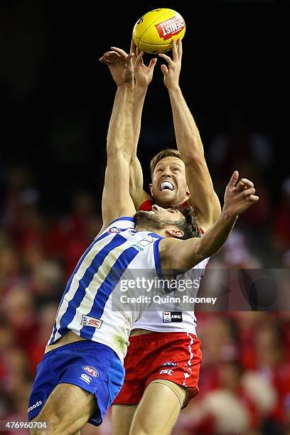 Jeremy Laidler of the Swans marks over the top of Jarrad Waite of the Kangaroos during the round 11 AFL match between the North Melbourne Kangaroos...