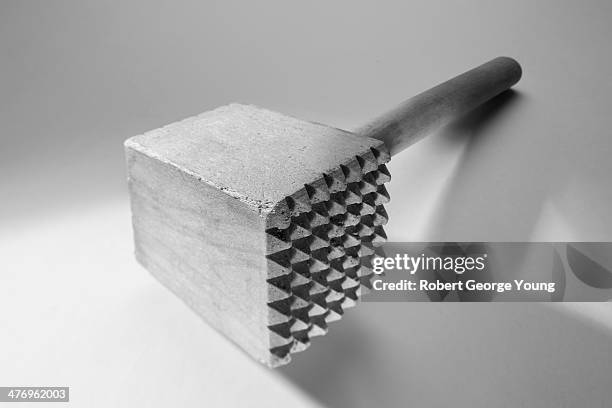 exaggerated perspective of a meat tenderizer - tenderizer stock pictures, royalty-free photos & images