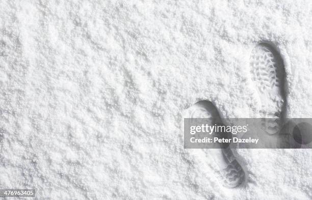 landscape powder snow scene with foot prints - sneeuw stockfoto's en -beelden