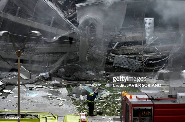 Fireman inspects the car park of Terminal 4 of Barajas Airport in Madrid, 30 December 2006, after a bomb explosion. Two people were listed as missing...