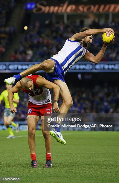 Jarrad Waite of the Kangaroos marks the ball over Rhyce Shaw of the Swans during the round 11 AFL match between the North Melbourne Kangaroos and the...