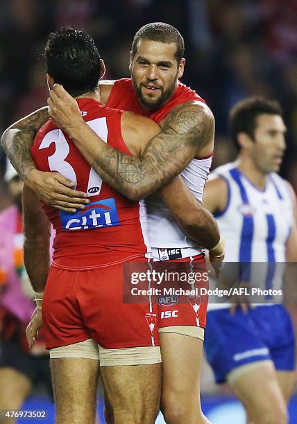 Adam Goodes of the Swans celebrates a goal with Lance Franklin of the Swans during the round 11 AFL match between the North Melbourne Kangaroos and...