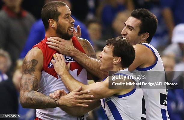 Lance Franklin of the Swans is choked by Michael Firrito of the Kangaroos and Brent Harvey during the round 11 AFL match between the North Melbourne...