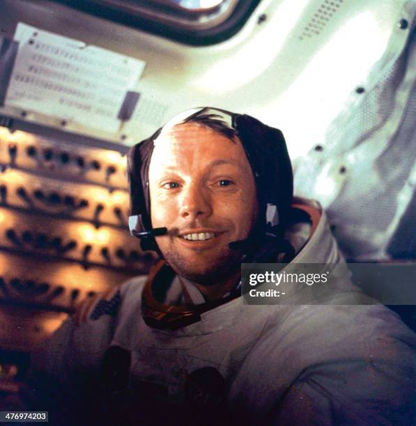 Apollo 11 space mission US astronaut Neil Armstrong is seen smiling at the camera aboard the lunar module "Eagle" on July 21, 1969 after spending...