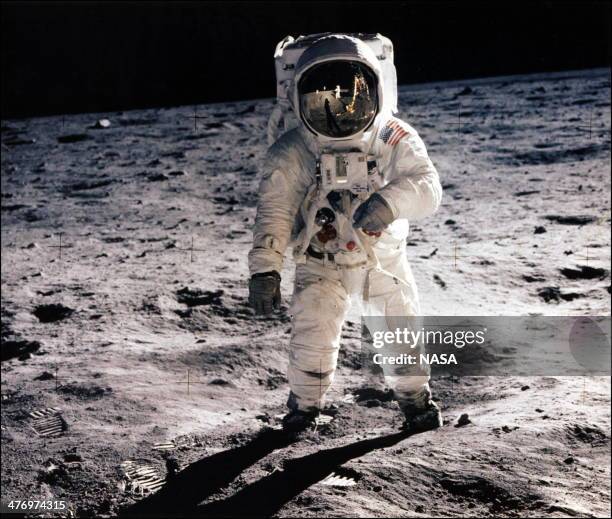 Picture taken 20 July of astronaut Buzz Aldrin, lunar module pilot, walking on the surface of the moon during the Apollo 11 extravehicular activity ....