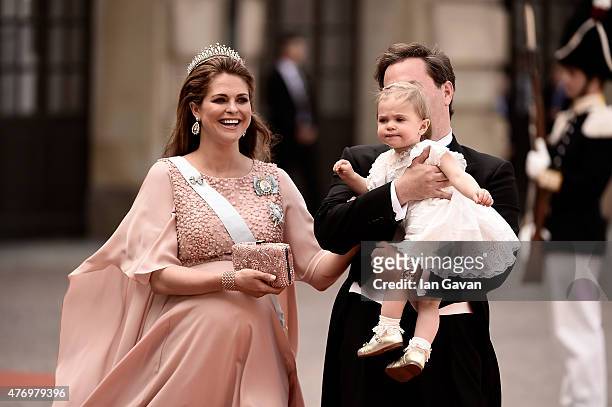 Princess Madeleine of Sweden, her husband Christopher O'Neill and their daughter Princess Leonore attend the royal wedding of Prince Carl Philip of...