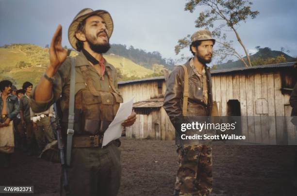 Soldier of the Sandinista Popular Army addresses workers on a state coffee plantation, Nicaragua, 1986.