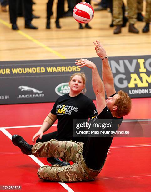 Prince Harry plays sitting Volleyball during the launch of the Invictus Games at the Copper Box Arena in the Queen Elizabeth Olympic Park on March 6,...