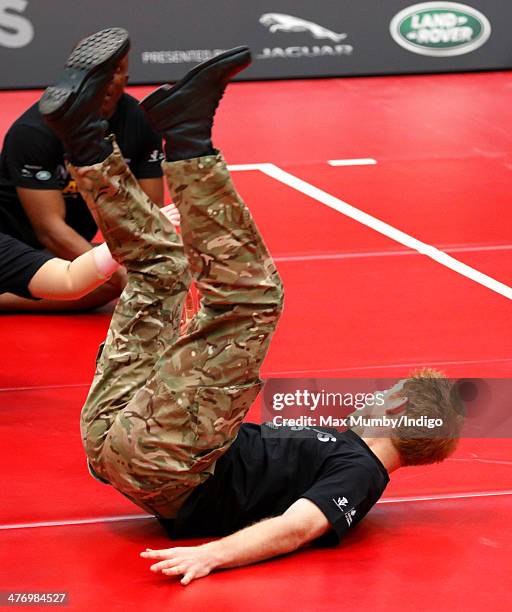 Prince Harry plays sitting Volleyball during the launch of the Invictus Games at the Copper Box Arena in the Queen Elizabeth Olympic Park on March 6,...