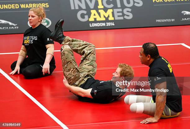 Prince Harry plays sitting Volleyball during the launch of the Invictus Games at the Copper Box Arena in the Queen Elizabeth Olympic Park on March 6,...